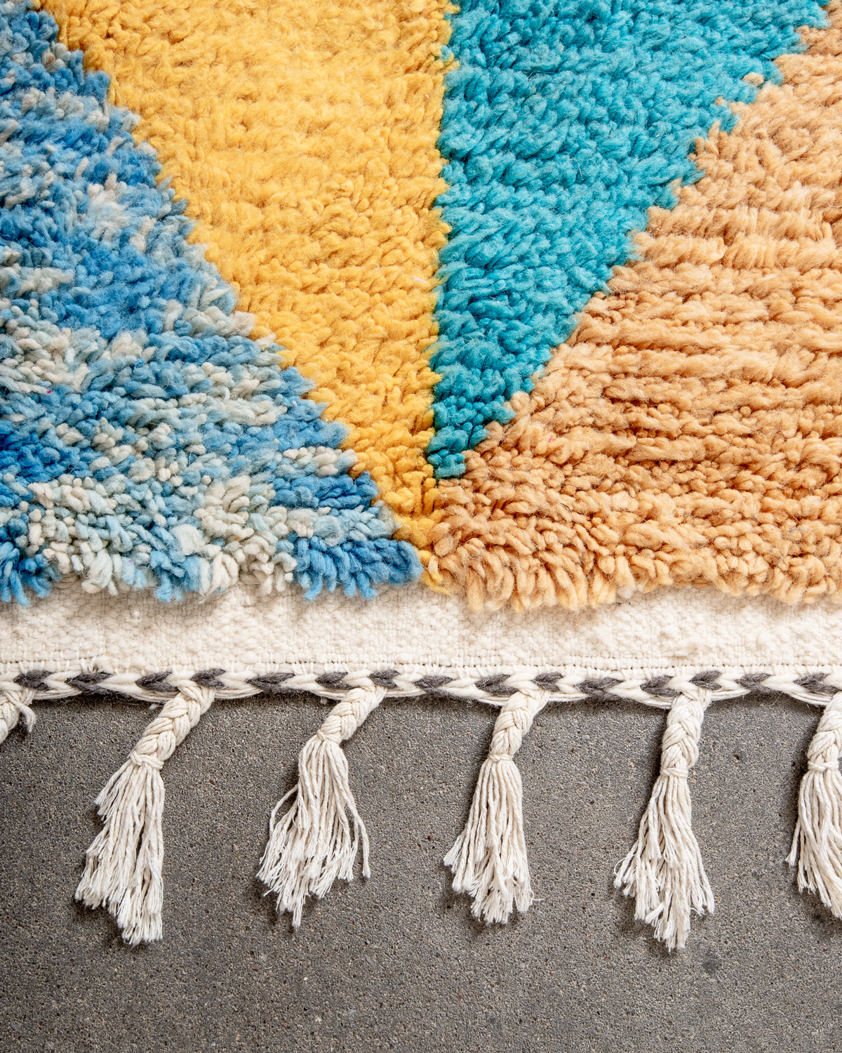 Modern, designer, handcrafted Berber rug from Morocco. Beniourain carpet with beautiful colours and patterns and fluffy wool texture.